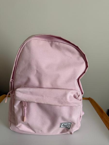 buy herschel backpack melbourne Supply Co A classic black Herschel backpack with a front pocket and embroidered Area 120 patch Classic Backpack